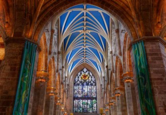 A stunning interior rendition of the St. Giles Cathedral in Edinburgh, Scotland.